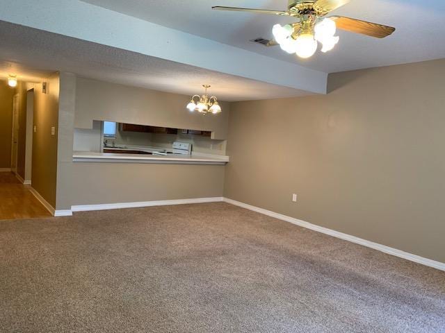 507 Chinas Cv Unit C, Fort Walton Beach, FL 32547 - kitchen with carpet, a chandelier, ceiling fan, light countertops, and hanging light fixtures