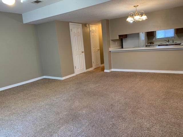 507 Chinas Cv Unit C, Fort Walton Beach, FL 32547 - unfurnished living room featuring carpet floors and a chandelier