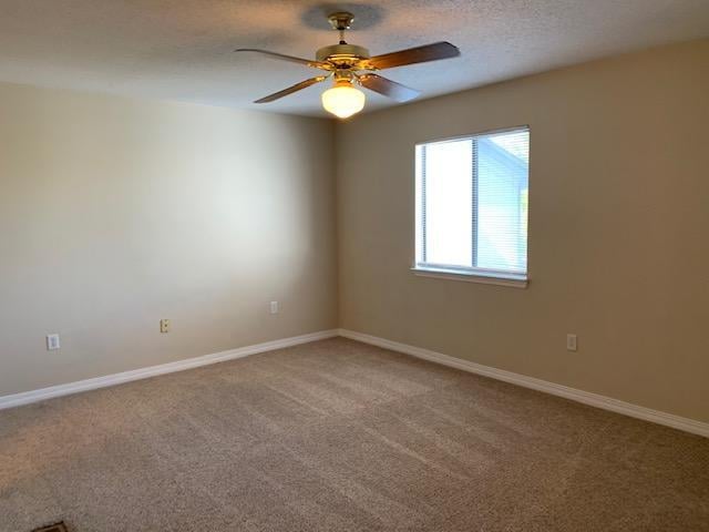 507 Chinas Cv Unit C, Fort Walton Beach, FL 32547 - spare room with light carpet and ceiling fan