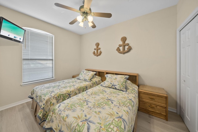 94 Terra Cotta Way, Destin, FL 32541 - bedroom with a closet, wood finished floors, and a ceiling fan