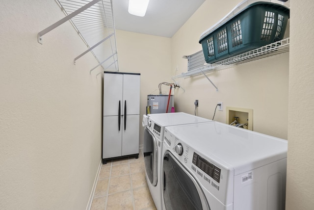 94 Terra Cotta Way, Destin, FL 32541 - laundry room with washer and dryer, electric water heater, and light tile patterned floors