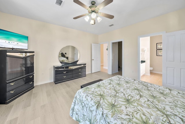 94 Terra Cotta Way, Destin, FL 32541 - bedroom featuring light wood-style flooring, ensuite bathroom, and a ceiling fan