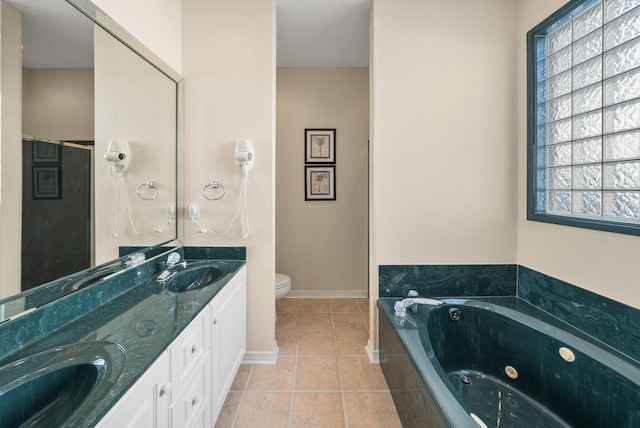94 Terra Cotta Way, Destin, FL 32541 - full bath with double vanity, healthy amount of natural light, a tub with jets, and tile patterned flooring