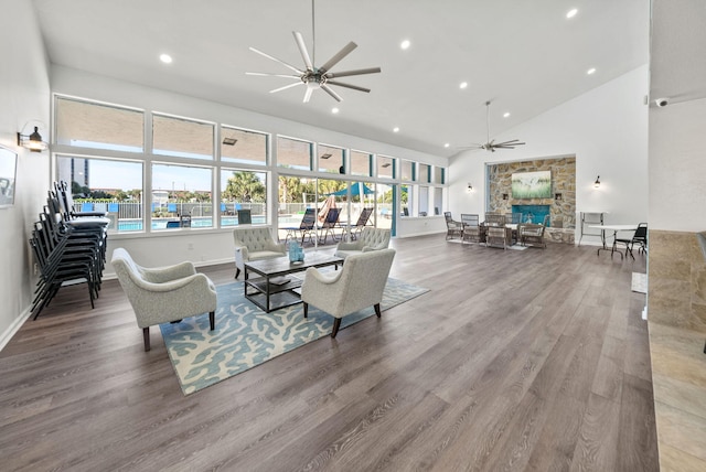 94 Terra Cotta Way, Destin, FL 32541 - living room with ceiling fan, recessed lighting, a fireplace, wood finished floors, and high vaulted ceiling