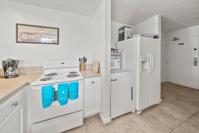 94 Terra Cotta Way, Destin, FL 32541 - kitchen featuring white appliances, light countertops, white cabinets, and light tile patterned floors