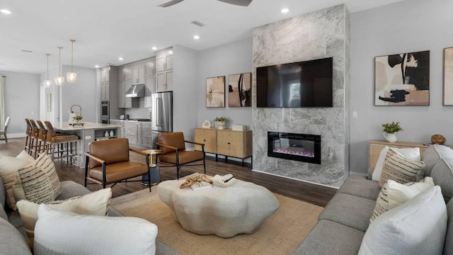28 W Queen Palm Dr, Inlet Beach, FL 32461 - living room with a high end fireplace, dark wood finished floors, a ceiling fan, and recessed lighting