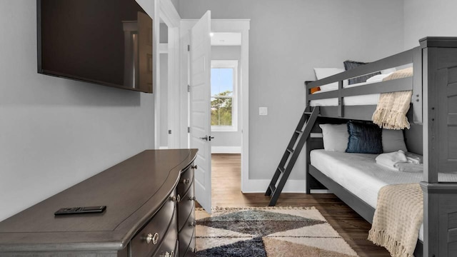 28 W Queen Palm Dr, Inlet Beach, FL 32461 - bedroom featuring dark wood-style flooring and baseboards