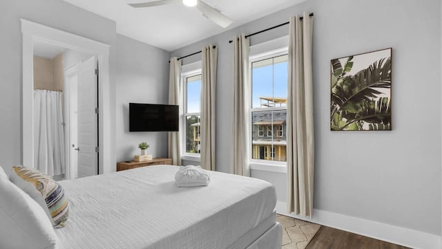 28 W Queen Palm Dr, Inlet Beach, FL 32461 - bedroom with ceiling fan and wood finished floors