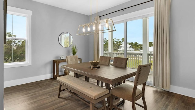 28 W Queen Palm Dr, Inlet Beach, FL 32461 - dining area featuring plenty of natural light, dark wood finished floors, and a chandelier