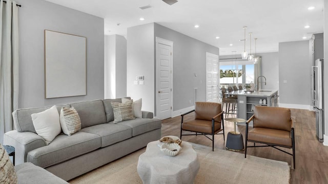 28 W Queen Palm Dr, Inlet Beach, FL 32461 - living room featuring light wood-style flooring and recessed lighting