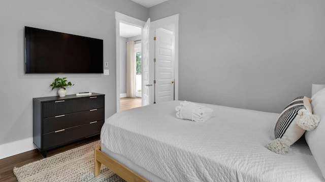 28 W Queen Palm Dr, Inlet Beach, FL 32461 - bedroom with wood finished floors and baseboards