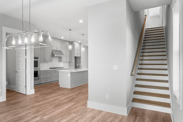28 W Queen Palm Dr, Inlet Beach, FL 32461 - staircase featuring recessed lighting and wood finished floors