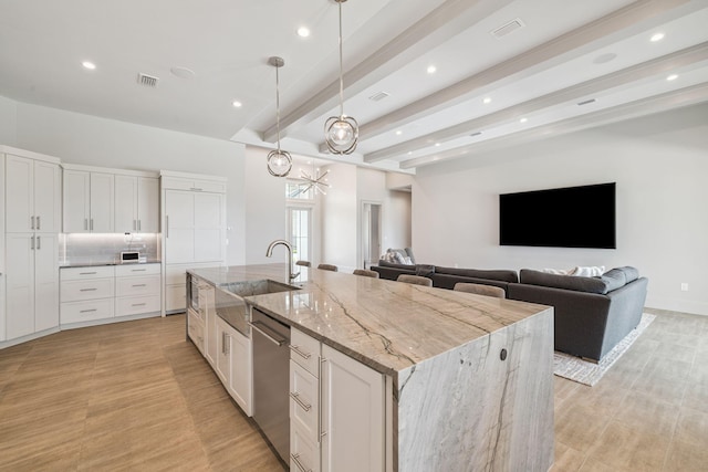 31 Driftwood Ct, Santa Rosa Beach, FL 32459 - kitchen featuring stainless steel dishwasher, a spacious island, light wood-style flooring, recessed lighting, and beam ceiling