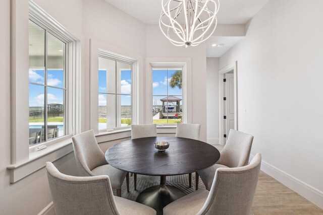 31 Driftwood Ct, Santa Rosa Beach, FL 32459 - dining area featuring a chandelier and baseboards