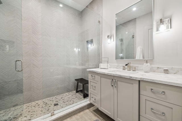 31 Driftwood Ct, Santa Rosa Beach, FL 32459 - bathroom featuring vanity, a stall shower, wood finished floors, and recessed lighting