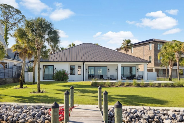 31 Driftwood Ct, Santa Rosa Beach, FL 32459 - back of property with stucco siding, a metal roof, and a patio