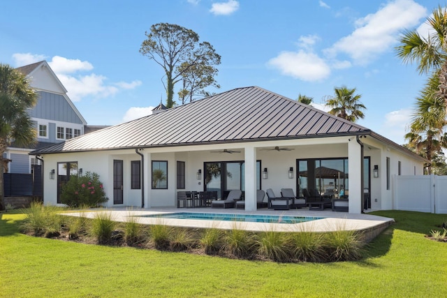 31 Driftwood Ct, Santa Rosa Beach, FL 32459 - back of property with a standing seam roof, an outdoor living space, ceiling fan, a metal roof, and stucco siding