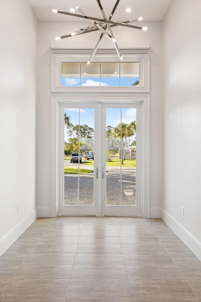 31 Driftwood Ct, Santa Rosa Beach, FL 32459 - doorway with baseboards and light tile patterned floors