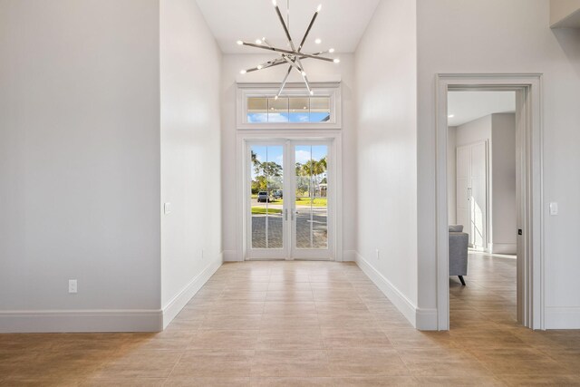 31 Driftwood Ct, Santa Rosa Beach, FL 32459 - foyer entrance featuring a chandelier, a towering ceiling, recessed lighting, and light tile patterned floors