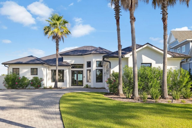 31 Driftwood Ct, Santa Rosa Beach, FL 32459 - view of front of home with stucco siding, a standing seam roof, french doors, a metal roof, and a front yard