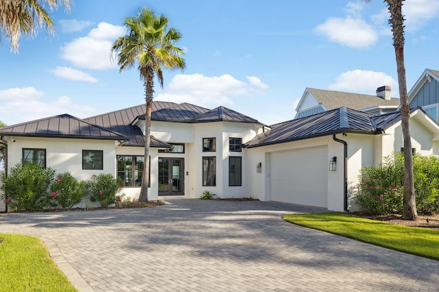 31 Driftwood Ct, Santa Rosa Beach, FL 32459 - view of front of property with a standing seam roof, stucco siding, a metal roof, and an attached garage