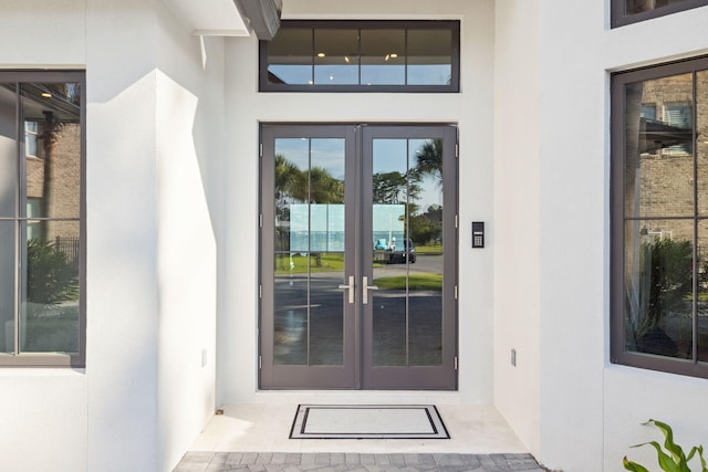 31 Driftwood Ct, Santa Rosa Beach, FL 32459 - property entrance with french doors and stucco siding