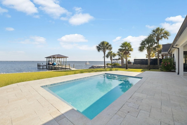 31 Driftwood Ct, Santa Rosa Beach, FL 32459 - view of swimming pool with a water view, boat lift, a lawn, and a patio