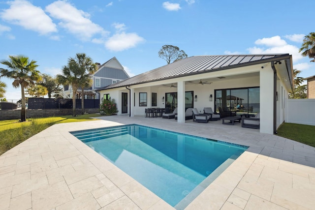 31 Driftwood Ct, Santa Rosa Beach, FL 32459 - back of property featuring a standing seam roof, a ceiling fan, an outdoor hangout area, and a metal roof