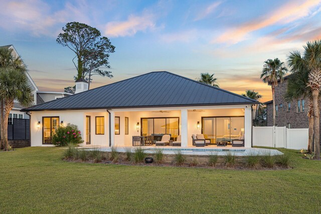 31 Driftwood Ct, Santa Rosa Beach, FL 32459 - back of property with an outdoor hangout area, ceiling fan, stucco siding, a metal roof, and a standing seam roof