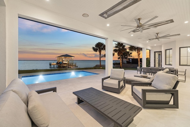 31 Driftwood Ct, Santa Rosa Beach, FL 32459 - swimming pool with outdoor lounge area, a water view, a patio area, and a ceiling fan