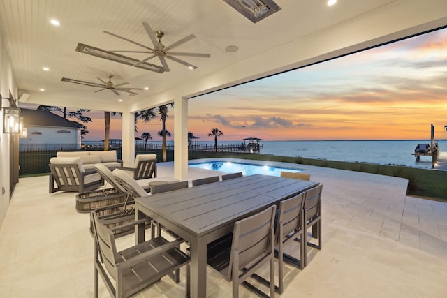 31 Driftwood Ct, Santa Rosa Beach, FL 32459 - view of patio with a water view, a ceiling fan, outdoor dining space, and an outdoor pool