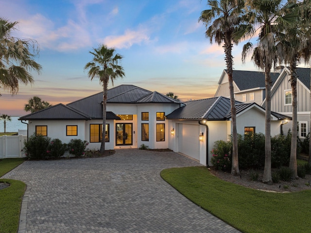 31 Driftwood Ct, Santa Rosa Beach, FL 32459 - modern farmhouse featuring a standing seam roof, a metal roof, an attached garage, decorative driveway, and stucco siding