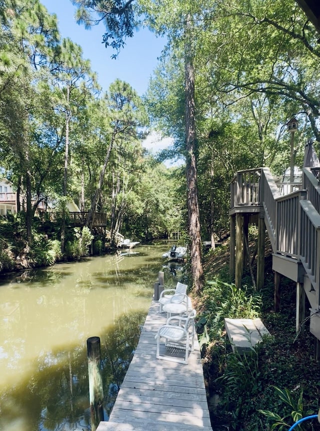 168 Nancy Claire Ln, Santa Rosa Beach, FL 32459 - dock area with stairway, a water view, and view of scattered trees