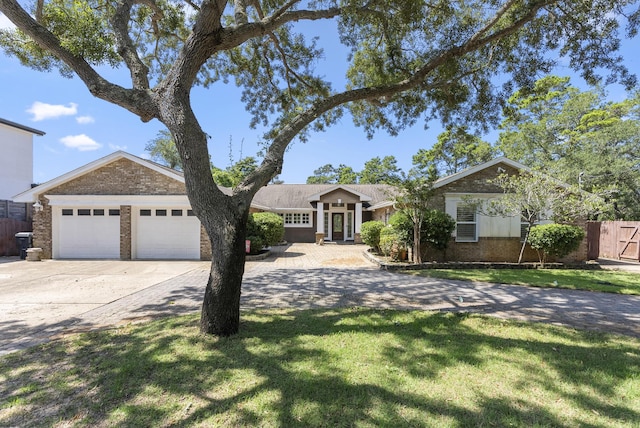 497 Walton Way, Miramar Beach, FL 32550 - ranch-style house with concrete driveway, brick siding, and a garage