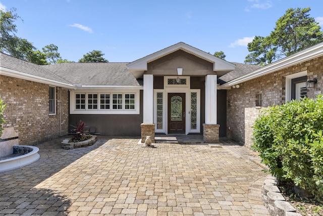 497 Walton Way, Miramar Beach, FL 32550 - property entrance with a shingled roof and brick siding