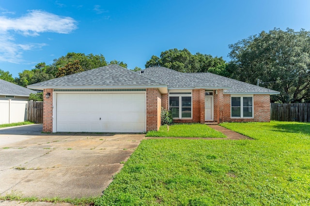8562 Vehlin Ct, Navarre, FL 32566 - single story home featuring a shingled roof, a garage, driveway, and brick siding
