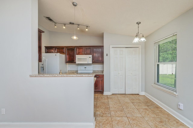 8562 Vehlin Ct, Navarre, FL 32566 - kitchen with white appliances, decorative light fixtures, a chandelier, lofted ceiling, and light tile patterned flooring