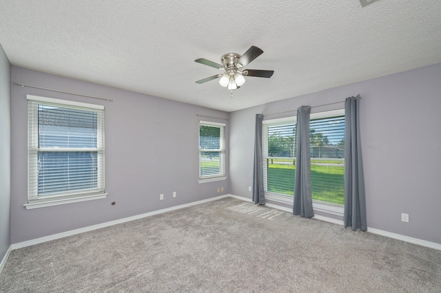 8562 Vehlin Ct, Navarre, FL 32566 - spare room featuring carpet, ceiling fan, and a textured ceiling