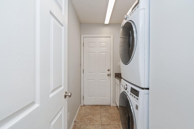 8562 Vehlin Ct, Navarre, FL 32566 - laundry room with stacked washer and clothes dryer and baseboards