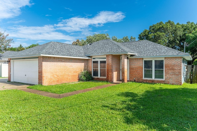 8562 Vehlin Ct, Navarre, FL 32566 - ranch-style home with roof with shingles, a garage, brick siding, and concrete driveway
