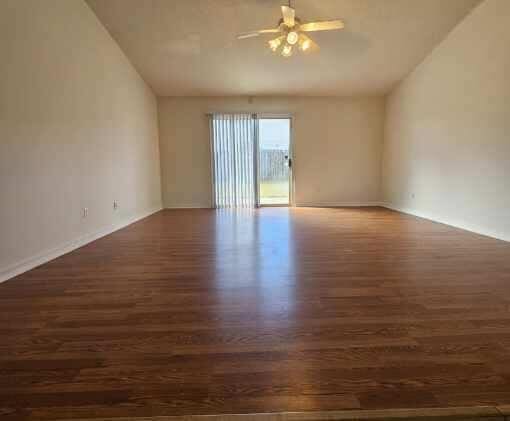 294 Limestone Cir, Crestview, FL 32539 - unfurnished room featuring wood finished floors, vaulted ceiling, and a ceiling fan