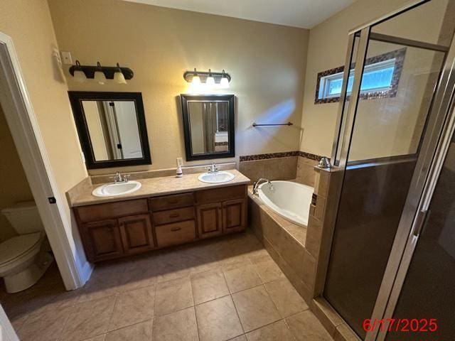 2071 Fountainview Dr, Navarre, FL 32566 - full bathroom featuring a bath, double vanity, tile patterned flooring, and a shower stall