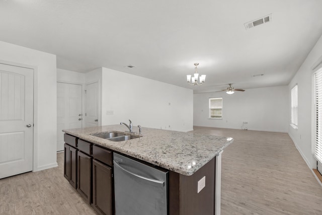 718 Widgeon Way, Crestview, FL 32539 - kitchen with dishwasher, light wood-type flooring, a chandelier, dark brown cabinetry, and open floor plan