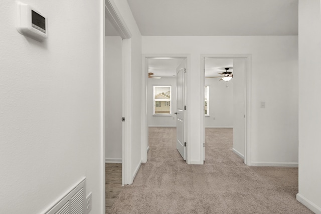 718 Widgeon Way, Crestview, FL 32539 - corridor featuring light carpet and baseboards