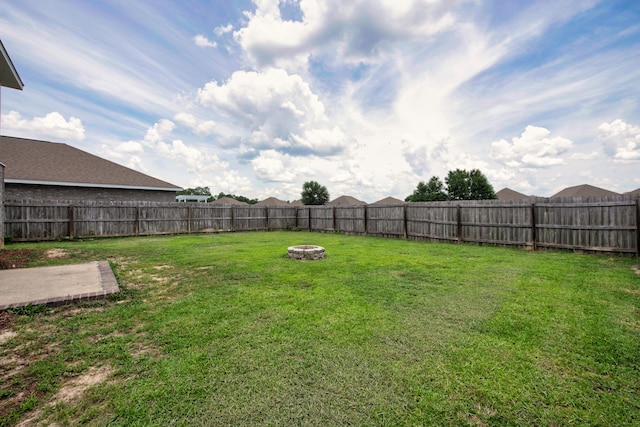 718 Widgeon Way, Crestview, FL 32539 - fenced backyard with an outdoor fire pit