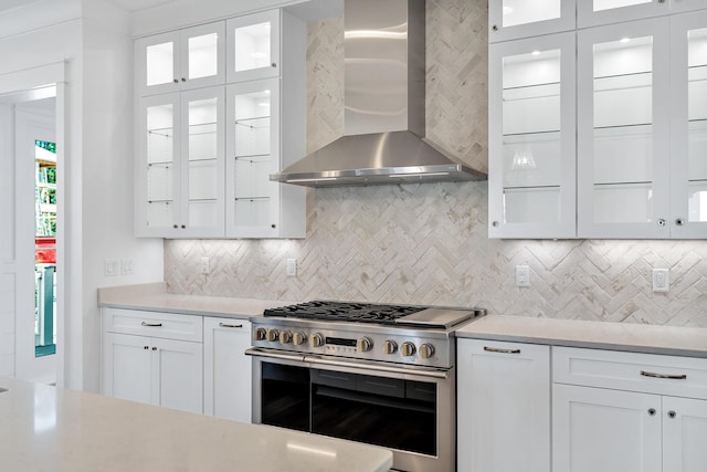 314 W Firethorn Cir Lot 33, Watersound, FL 32461 - kitchen featuring double oven range, wall chimney range hood, backsplash, and white cabinets