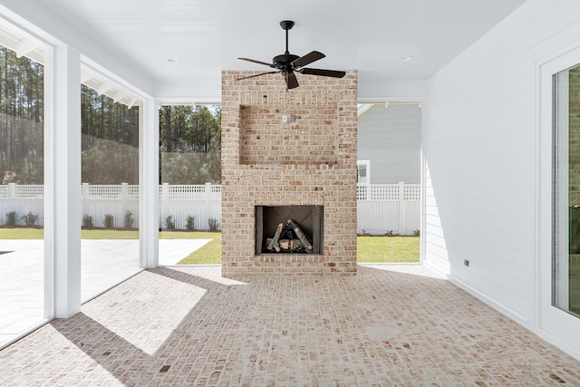 314 W Firethorn Cir Lot 33, Watersound, FL 32461 - unfurnished living room featuring ceiling fan, an outdoor brick fireplace, and recessed lighting