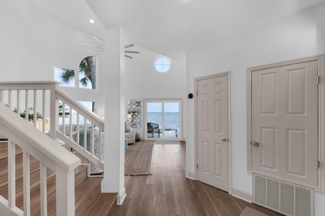 961 Northshore Dr, Miramar Beach, FL 32550 - hall featuring a high ceiling, wood finished floors, and a water view