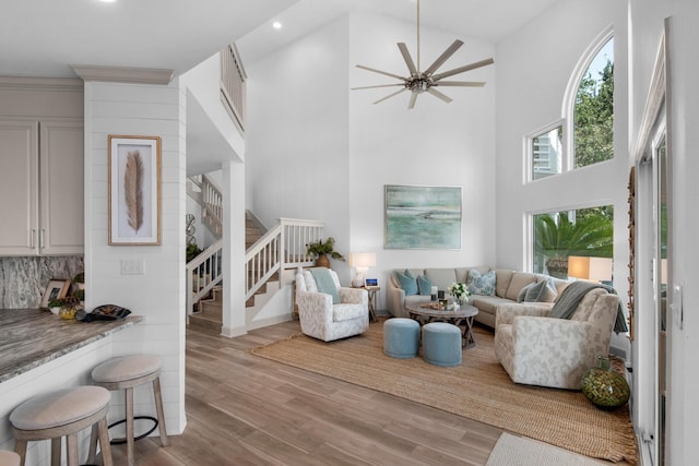 961 Northshore Dr, Miramar Beach, FL 32550 - living room with a high ceiling, stairway, wood finished floors, recessed lighting, and a ceiling fan