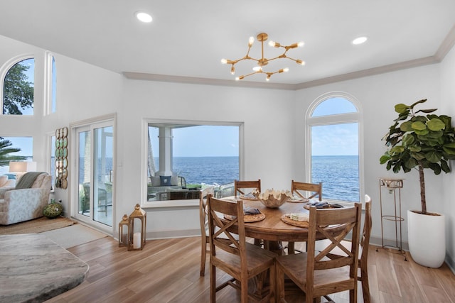 961 Northshore Dr, Miramar Beach, FL 32550 - dining area featuring light wood-style flooring, a water view, a chandelier, and recessed lighting